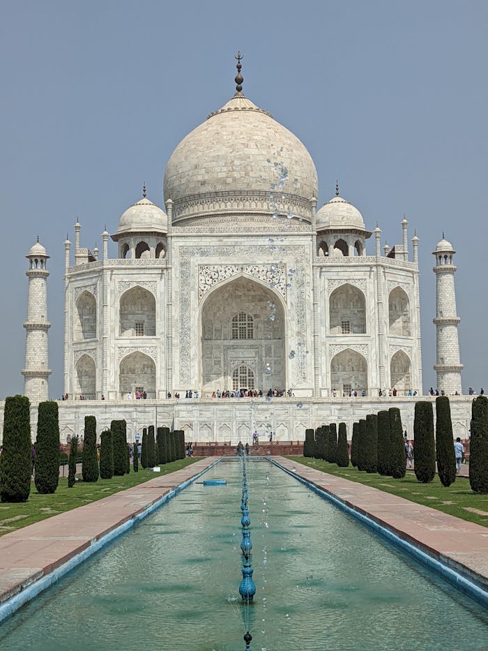 portfolio-img-02 Stunning vertical shot of the iconic Taj Mahal, showcasing its architectural beauty and reflective pond.