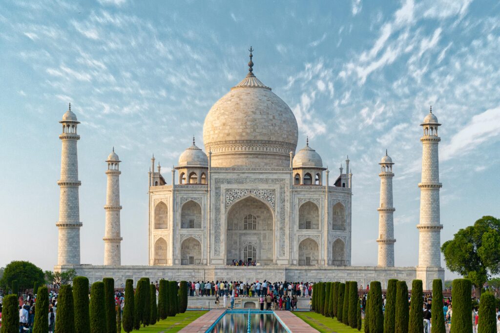 Home Same day Agra tour from Delhi by car Explore the iconic Taj Mahal, a UNESCO World Heritage Site in Agra, India, captured under a bright blue sky.