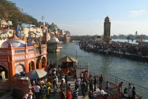 Delhi to Haridwar Tour A vibrant scene at the Ganges Ghats in Haridwar during a Hindu festival, showcasing cultural richness.