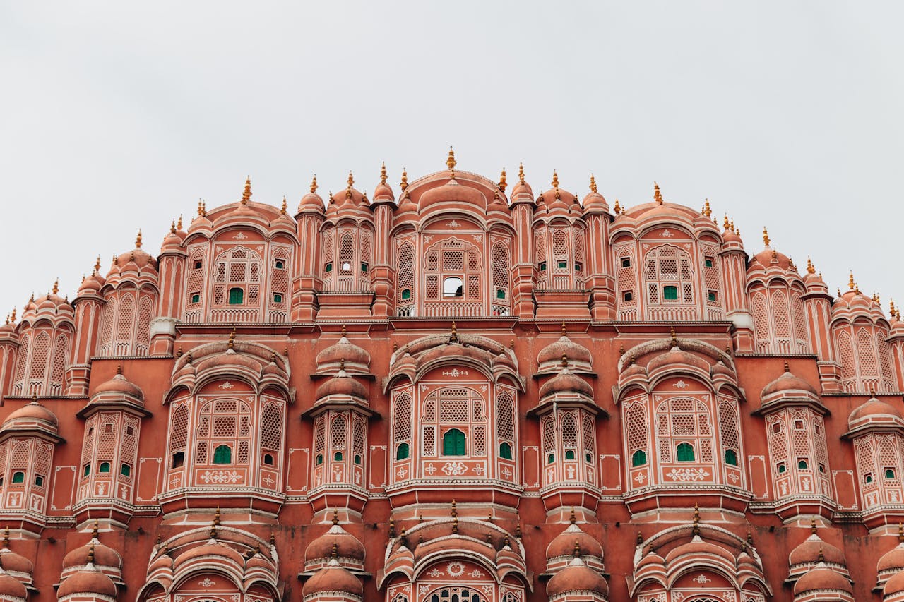 about-img Hawa Mahal's iconic pink facade showcases stunning Rajasthani architecture in Jaipur, India.