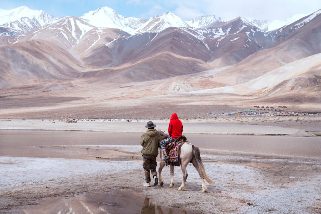 pexels photo 34998306 34998306 A serene horseback ride along the shores of Pangong Lake, surrounded by the majestic Himalayas.
