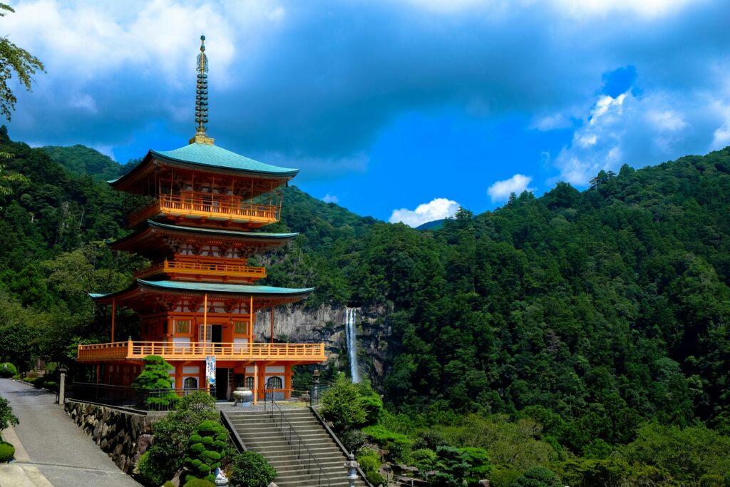 pexels photo 96932 96932 Beautiful view of Kumano Nachi Taisha with a pagoda surrounded by lush green mountains and a waterfall.